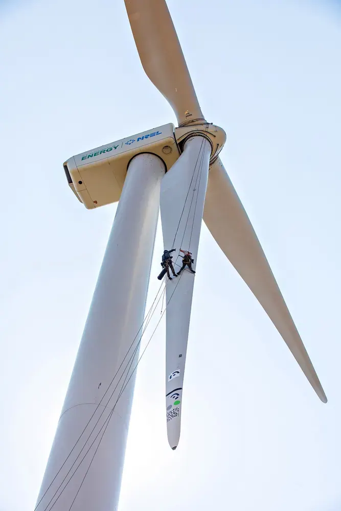 Maintenance work near the rotor of a wind turbine.