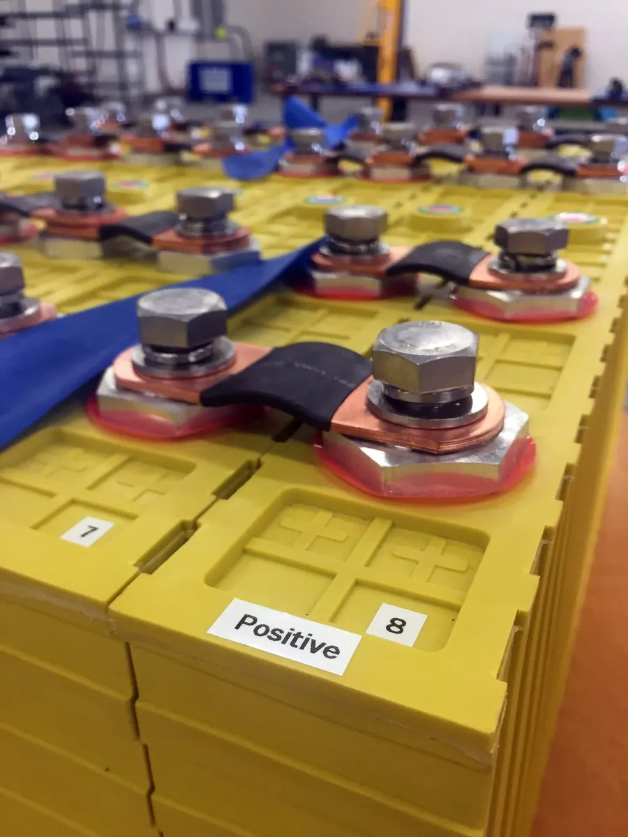A bank of large lithium iron phosphate battery cells connected together.