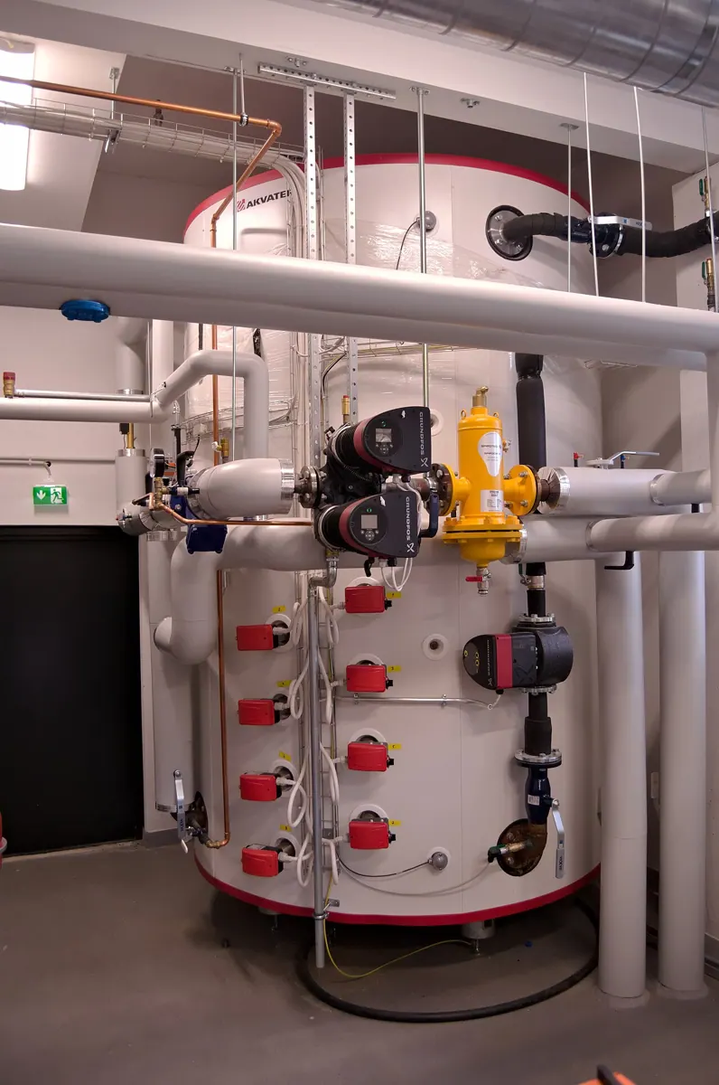 Insulated pipework, valves and pumps at the Qvidja combined heat and power plant.