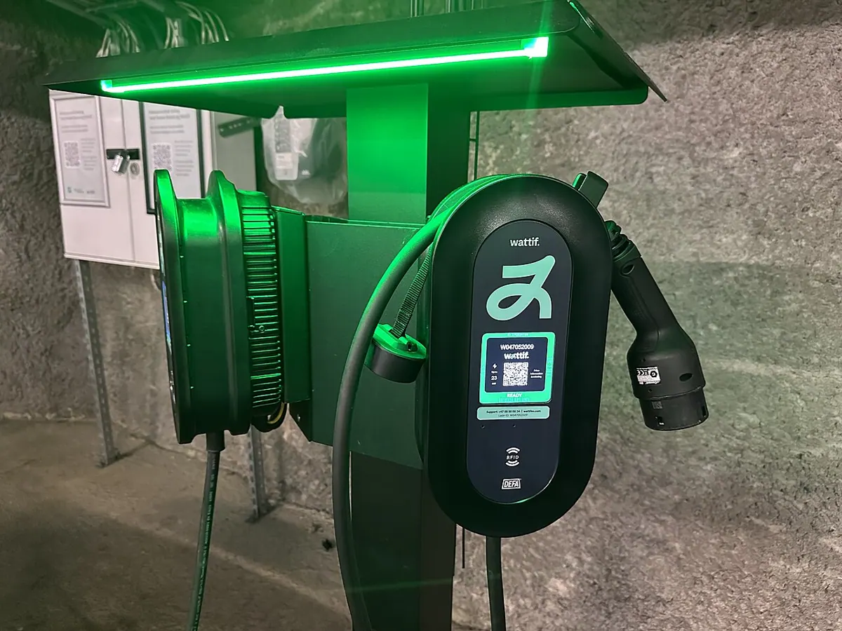 Shared electric vehicle charging spaces inside an underground parking garage in Bergen.