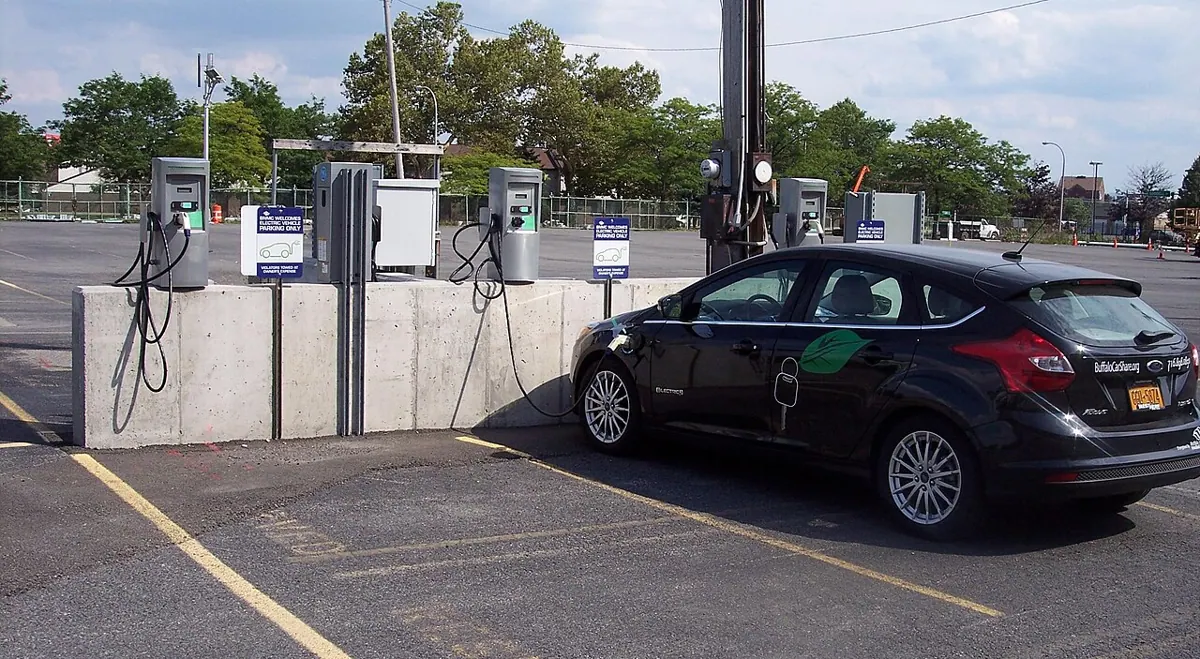 Electric car charging equipment in a shared parking area.