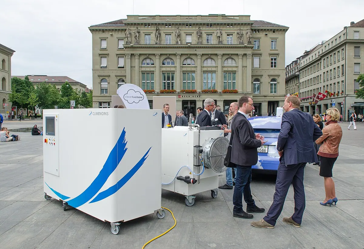 Climeworks carbon capture equipment displayed at an outdoor event.